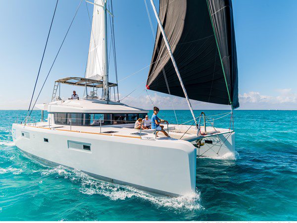 on the water shot of the lagoon 52 multihull sailing through the water